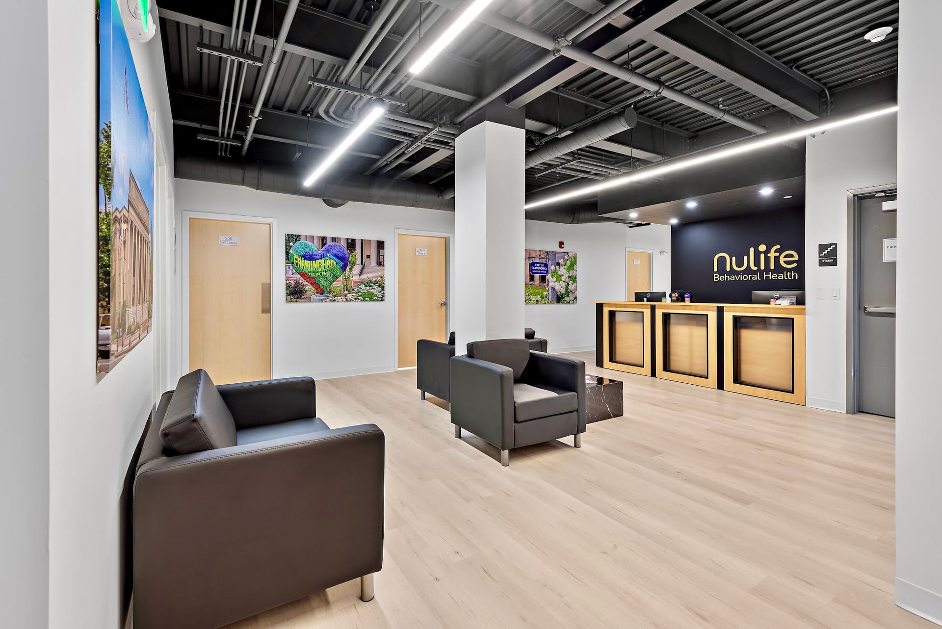 Modern reception lobby with dark leather chairs at Nulife Behavioral Health Framingham