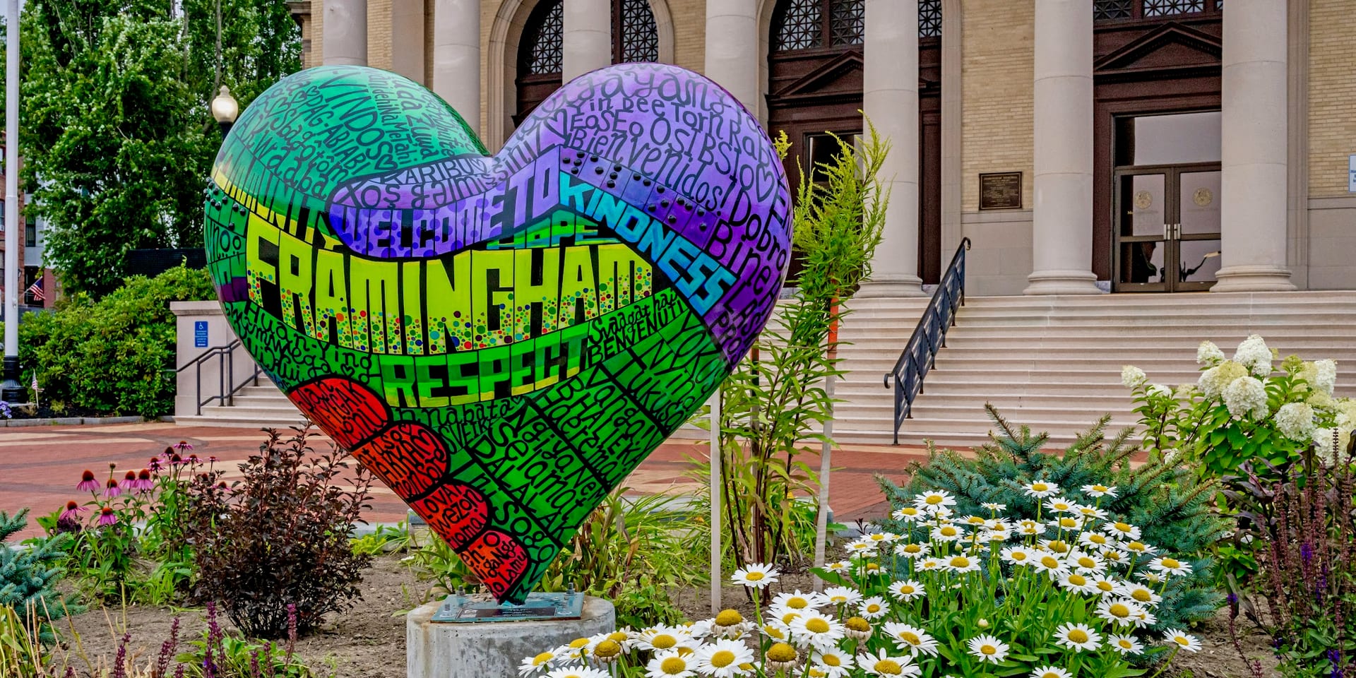Colorful heart sculpture reading Welcome to Framingham outside city hall