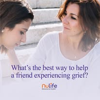 Two women sitting together, one listening supportively to the other in distress.