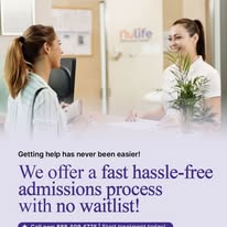 Smiling staff member welcomes patient at Nulife behavioral health front desk